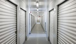 A perspective view down a corridor of storage units