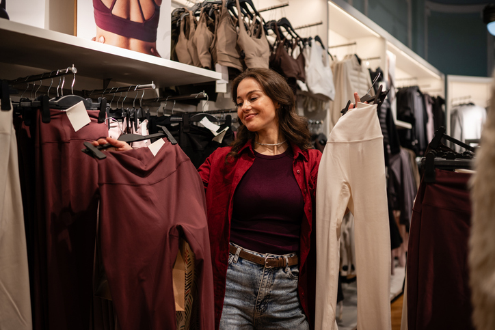 Woman shopping for athletic leggings depends on lifestyle retail facility management to make the experience pleasant and memorable